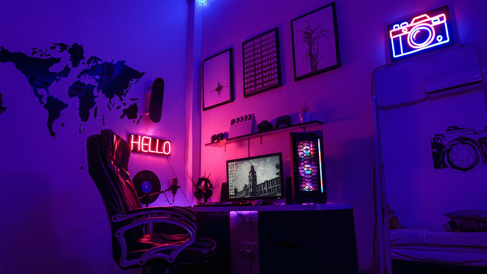 Neon-lit gaming den with wall art and a battlestation